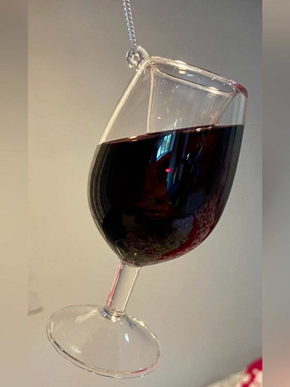 Ganz Merry Merlot Wine Glass Ornament shaped like a tilted glass with wine